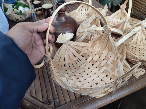 handicrafts from woven craftsmen. Products made of woven bamboo. Indonesian products from woven bamboo into containers for storing various goods.