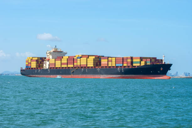 istock International Container ship loading, unloading at sea port, Freight Transportation, Shipping,  Vessel. Logistics, import export, Transportation. Global transport business. 1595495904