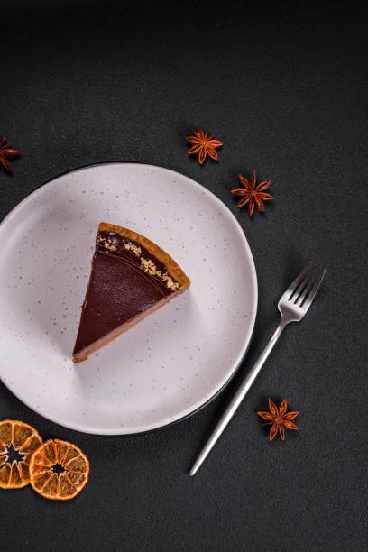 istock Delicious, fresh, sweet chocolate cake with nuts cut into slices 1595609206