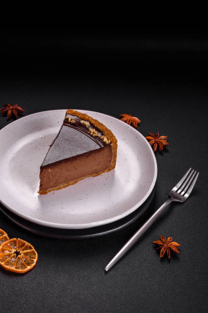 istock Delicious, fresh, sweet chocolate cake with nuts cut into slices 1595609735