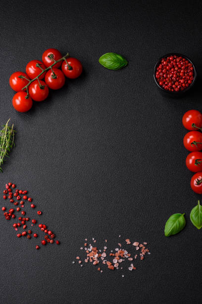 istock Ingredients for cooking cherry tomatoes, salt, spices and herbs 1595617159