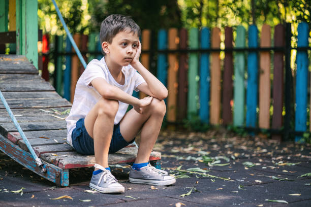 istock Sad kid on the playground 1595629833