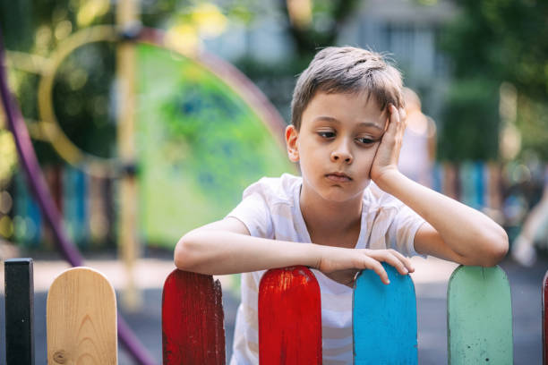 istock Boy feeling lonely at the playground 1595629835