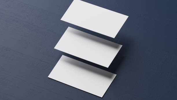 istock White business cards falling on blue desk 1595661226