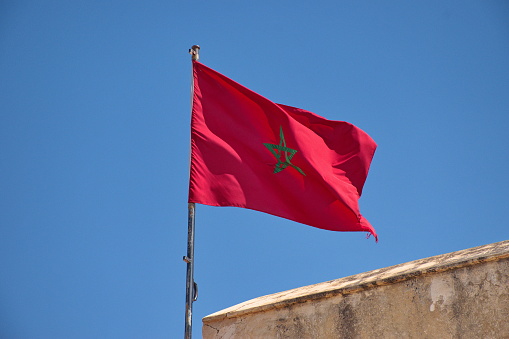 The flag of Morocco flies in the wind