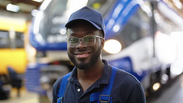 Portrait of train engineer in railway maintenance workshop