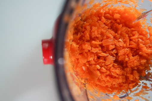 single electric food processor at retail store shelf, defocused background