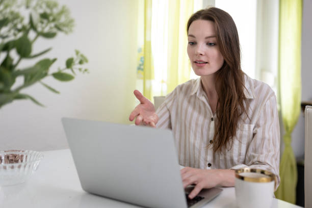 istock A woman uses a laptop 1595812385
