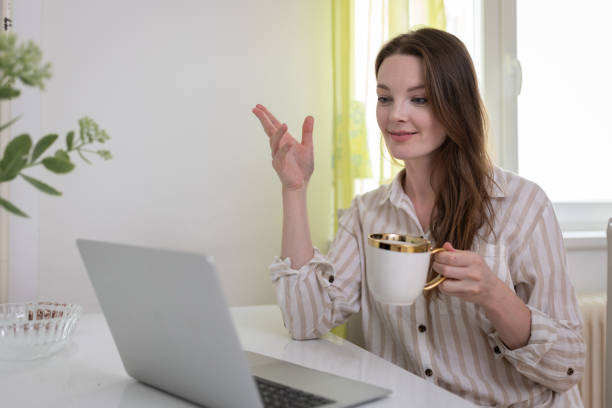 istock A woman uses a laptop 1595812408