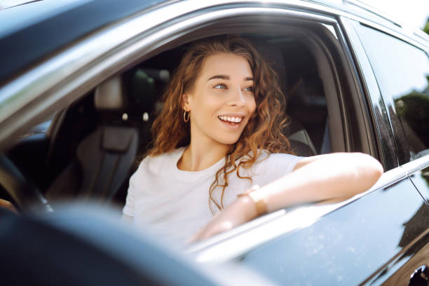 istock Stylish woman driving a car. 1595869828