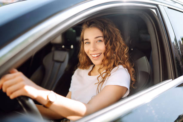 istock Stylish woman driving a car. 1595869834