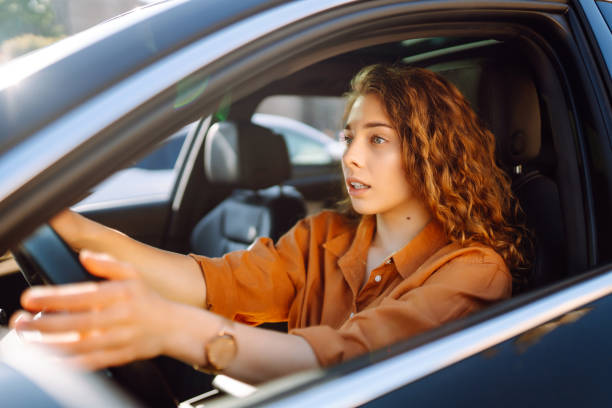 istock Stylish woman driving a car. 1595872454