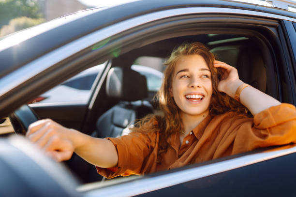 istock Stylish woman driving a car. 1595872455