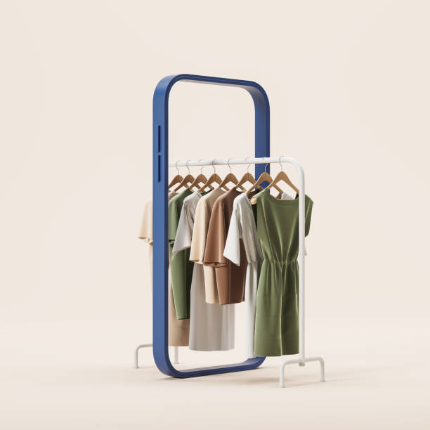 istock Clothes hanging on a rail, abstract smartphone screen on beige background 1595879918