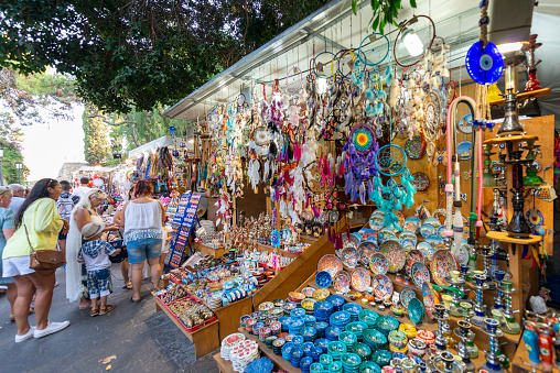 Porreres, Mallorca, Spain - October 27, 2019: Siurells, typical Majorcan hand painted clay figures with a whistle, for sale on Porreres Market. Majorca, Spain