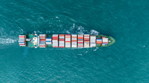 istock op View Cargo container Ship, cargo maritime ship with contrail in the ocean ship carrying container and running for export concept technology freight shipping sea freight by Express Ship 1595884814
