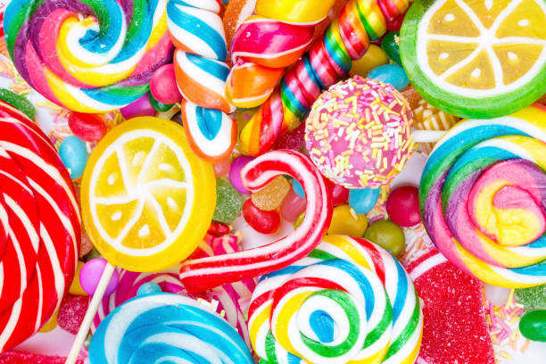 istock Colorful lollipops and different colored round candy. Top view. 1595885346