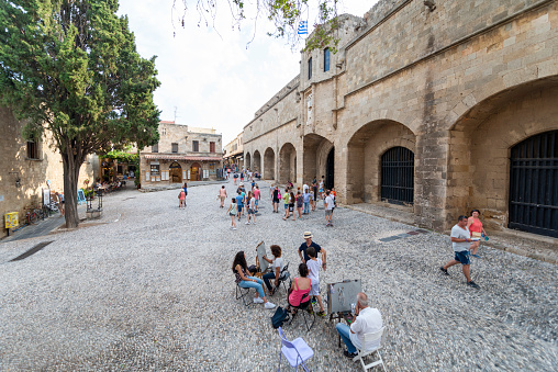 Tourists roaming the street in the historic city. August 05, 2016 Old Town, Rhodes Island, Greece