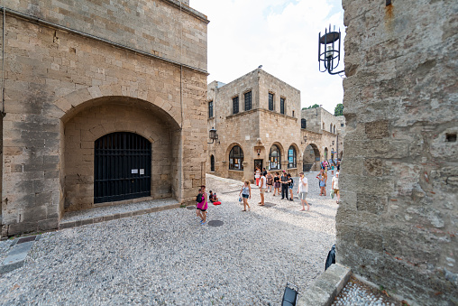 Tourists roaming the street in the historic city. August 05, 2016 Old Town, Rhodes Island, Greece