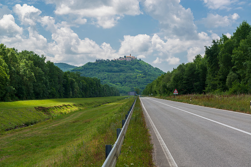 Higway in Istria, Croatia with picturesque old Motovun town on the hill. Vacation in Europe.