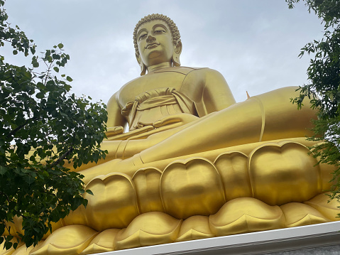 Statue of laughing Buddha. The Jao Mae Soi Dok Mak chinese taoist Shrine in Ayutthaya. Phra Nakhon Si Ayutthaya. Thailand.