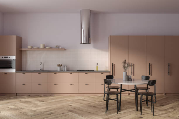 istock Stylish hotel kitchen interior with dining table and cabinet with kitchenware 1595902998