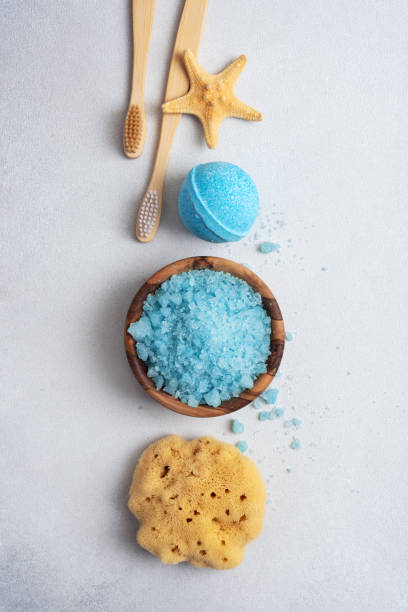 Bath Spa Setting with sea salt, natural wild sponge and bamboo toothbrushes Bath Spa Setting with sea salt, natural wild sponge and bamboo toothbrushes. Concept for sustainable leaving. sponge bath sponge nature animal stock pictures, royalty-free photos & images