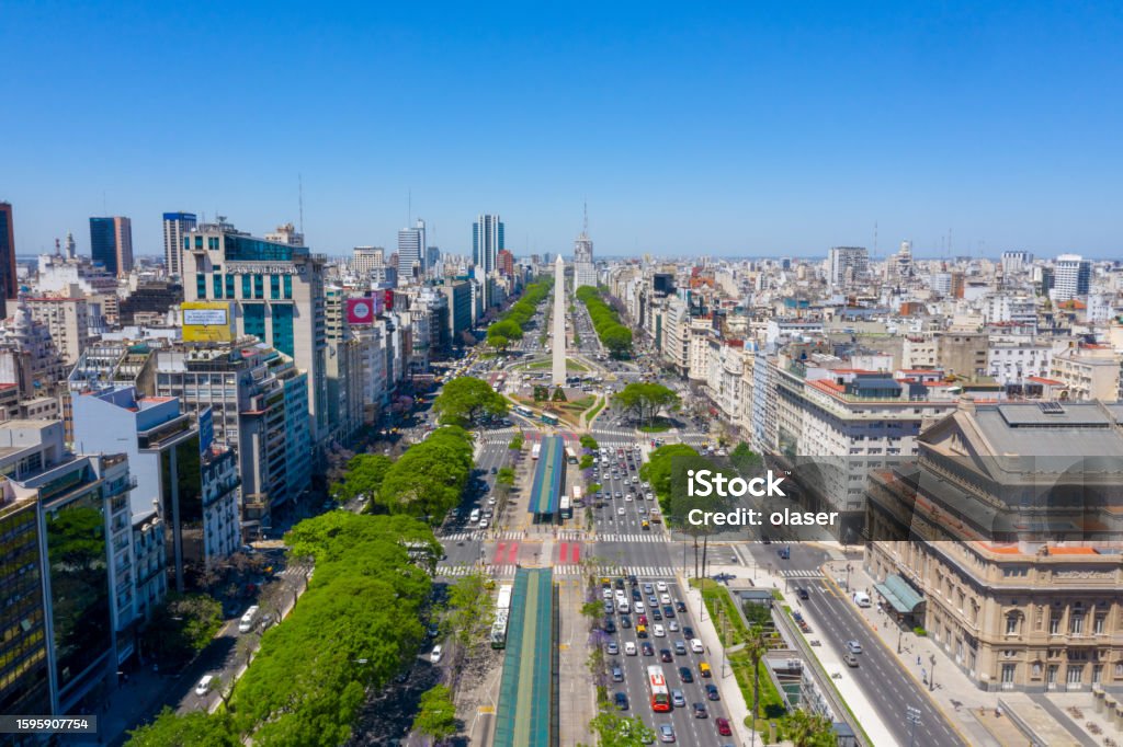 Obelisk landmark in Buenos Aires and green letters BA Obelisk of Buenos Aires, historic monument and icon of Buenos Aires, located in the Plaza de la Republica in the intersection of avenues Corrientes and 9 de Julio, Buenos Aires, Argentina Aerial View Stock Photo