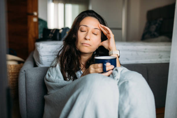 istock Woman suffering from stress sitting on the floor 1595921330