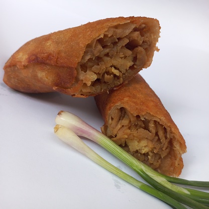Fried bamboo shoot spring rolls filled with a mixture of bamboo shoot, egg, chicken meat from Indonesia. Sweet and savory, delicious food from Asia