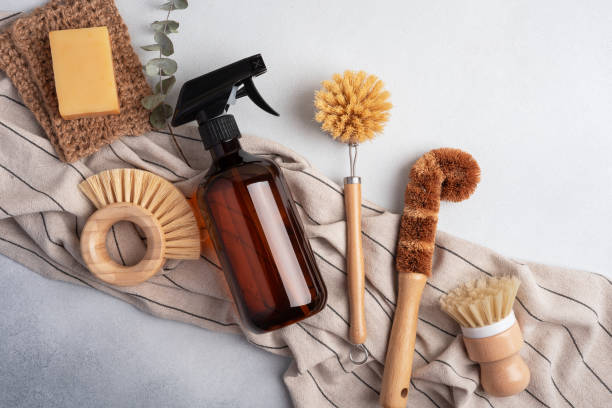 istock Eco-friendly cleaning set with amber soap bottle and wooden dish brushes 1595934028