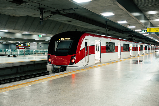 Red line sky train is running in downtown of Bangkok, Thailand