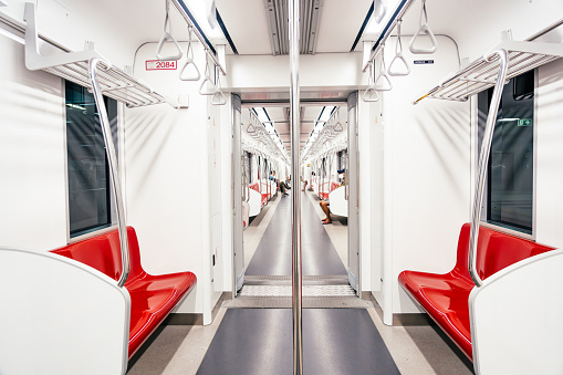 Empty interior in red line sky train is running in downtown of Bangkok, Thailand