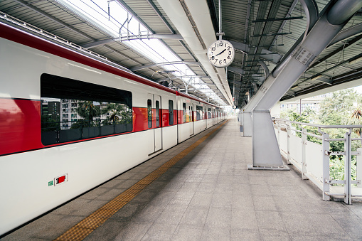 Red line sky train is running in downtown of Bangkok, Thailand