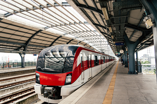 Red line sky train is running in downtown of Bangkok, Thailand