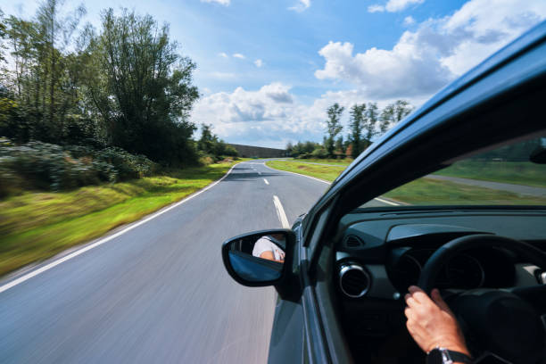 istock Motorway Infrastructure Driving Fast with Car on Country Road 1595963579