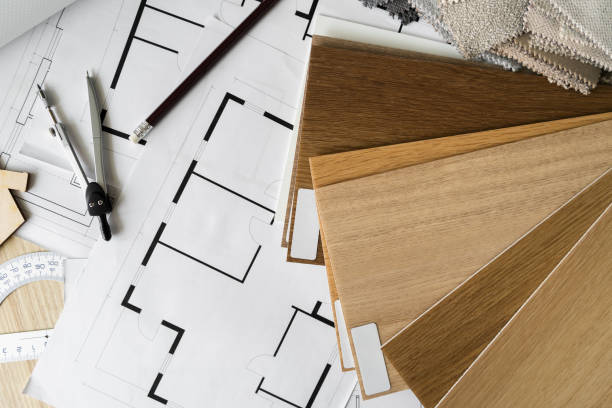 istock Wooden flooring samples, home floor plans, building structural blueprint projects, accessories for architect or interior designer. Flat lay design studio desk composition. 1595965209