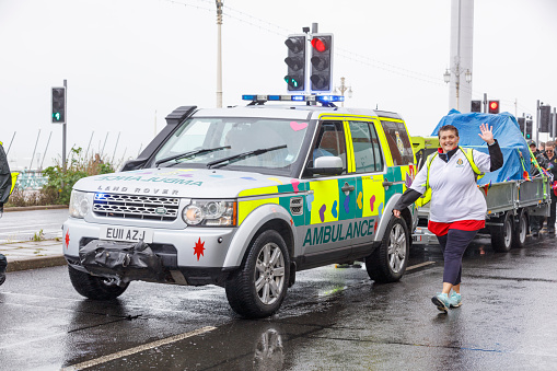 Brighton, England - August 5th 2023: NHS Ambulance services at the pride parade. The Brighton & Hove Pride Parade 2023 begins in wet and rainy conditions on August 05, 2023, in Brighton, England.