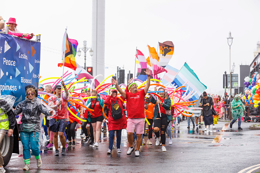 Brighton, England - August 5th 2023: NHS University hospitals Sussex at the pride parade. The Brighton & Hove Pride Parade 2023 begins in wet and rainy conditions on August 05, 2023, in Brighton, England.