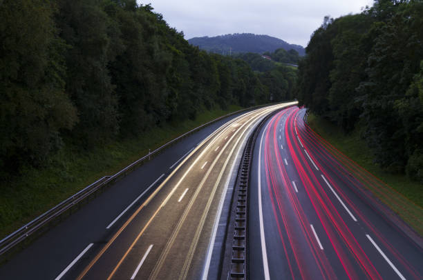 istock Car lights at night on the highway 1596016687