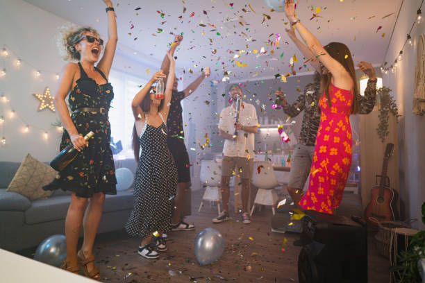 istock Friends dancing during an New Year house party 1596055981