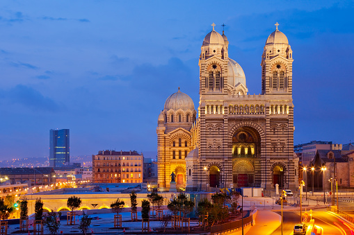 Image of Madrid skyline with Santa Maria la Real de La Almudena Cathedral and the Royal Palace during sunset.