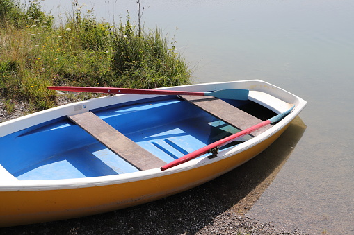 A boat or a boat with a motor on a trailer with wheels for transportation by car with a trailer.