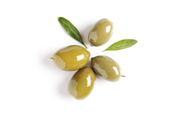 istock Delicious green olives with leaves isolated on white 1596094366