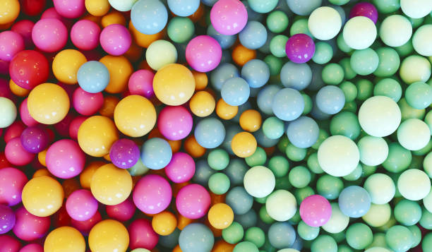 istock Pastel colored balls in different sizes lay in a heap 1596104043