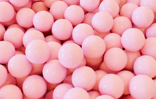 istock Pink Colored Marbles Converge in Striking Design 1596105641