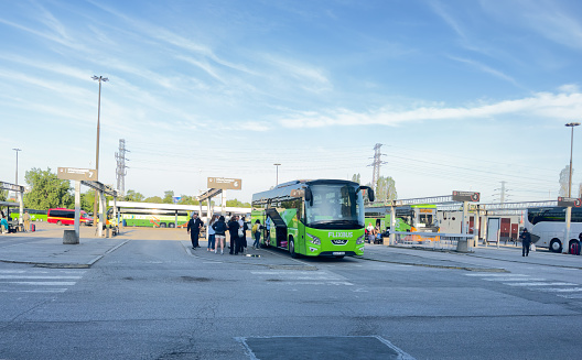 Passenger Green bus of company FlixBus in bus parked bus station Zahodnia in Warsaw. FlixBus on parked of Public transport. Low cost bus travel in Europe. Warszawa, Poland, April 05, 2023