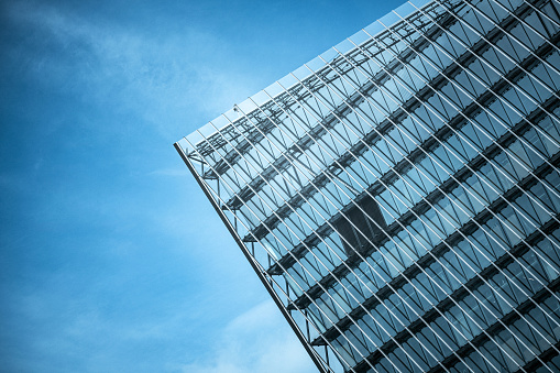 Glass facade of a modern office building in Bangkok, Thailand