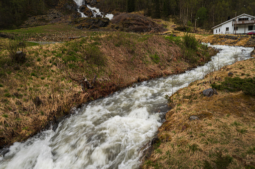 waterfall close-up near the Tennevoll village during a springtime day, Northern Norway