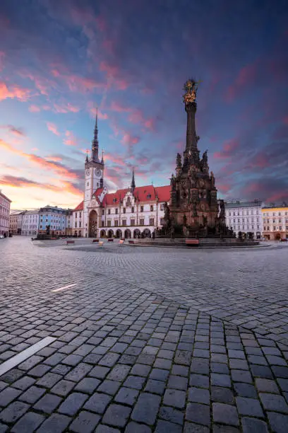 Cityscape image of downtown Olomouc, Czech Republic with Olomouc City Hall and Honorary Holy Trinity Column at summer sunrise.